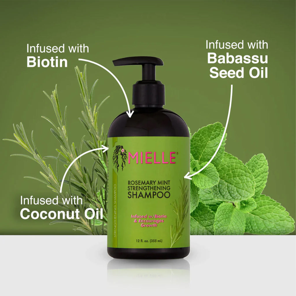 Bottle of Mielle Rosemary Mint Strengthening Shampoo - 355ml, enriched with biotin and organic oils, on a green background.
