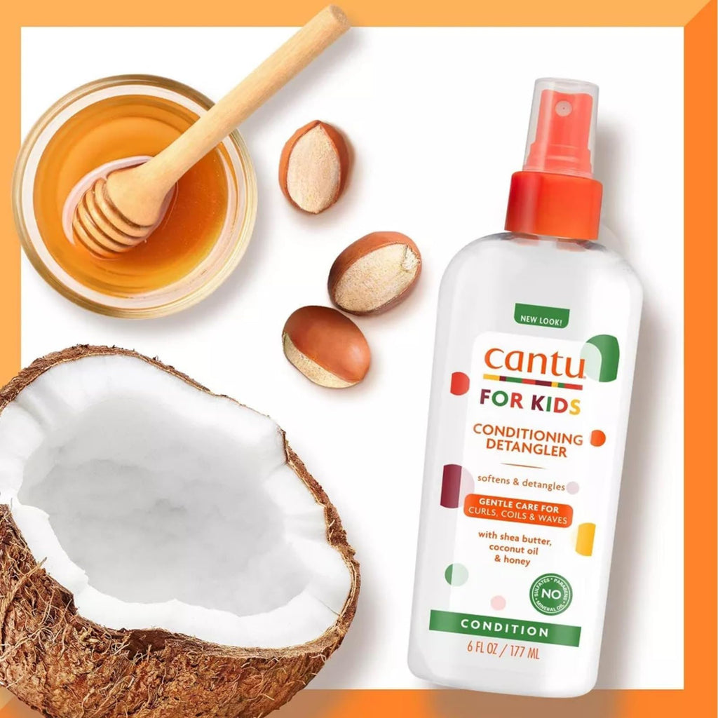  Bottle of Cantu Care for Kids Conditioning Detangler - 177 ml, surrounded by shea butter, coconut oil, and honey.