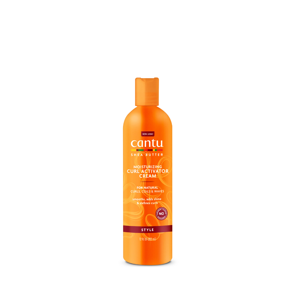 Bottle of CANTU Shea Butter Moisturizing Curl Activator Cream on a orange background.